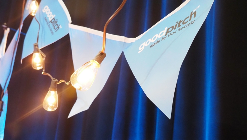 stringed pennants hanging behind a string of light bulbs