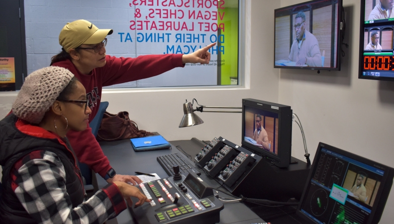 two people working on production of a TV show