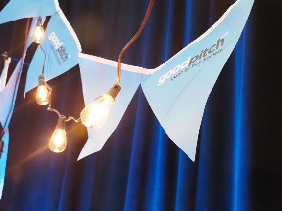 stringed pennants hanging behind a string of light bulbs