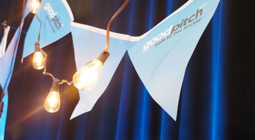 stringed pennants hanging behind a string of light bulbs